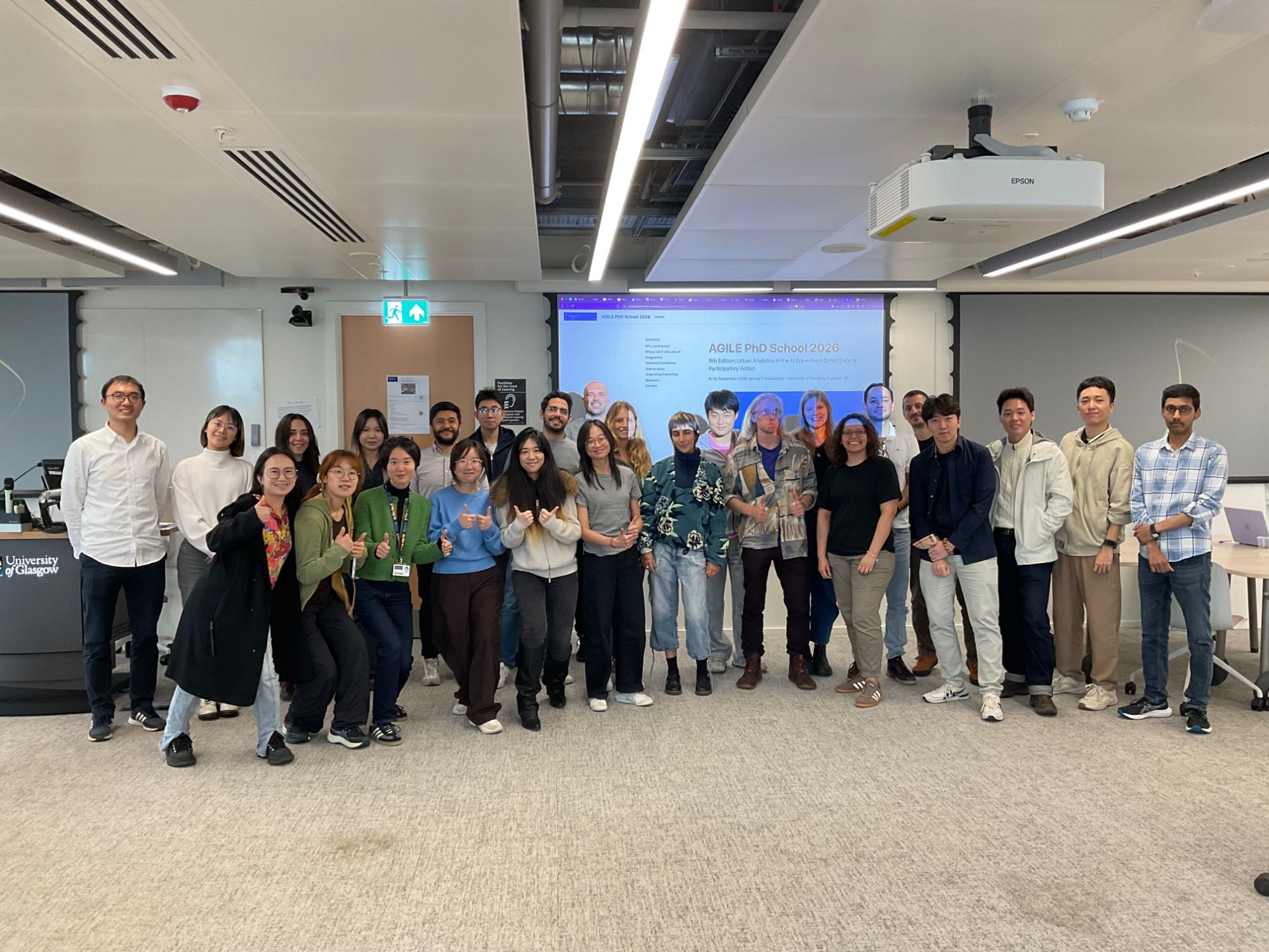Group photo of the AGILE PhD School 2026 participants and organisers in the Adam Smith Building
